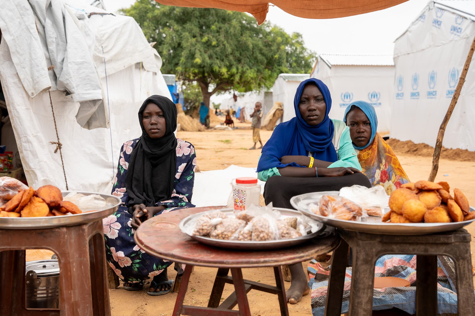 Chad. Selling sweets in Arkoum refugee camp